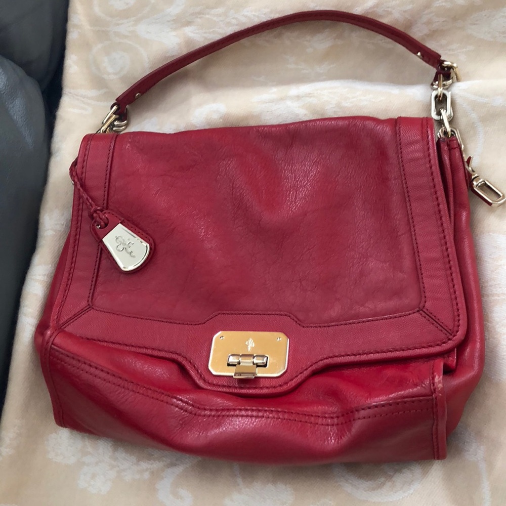 Cole Haan Red leather purse with gold accents